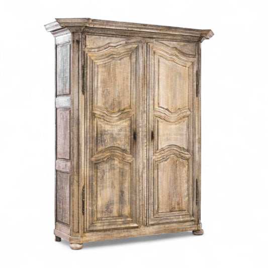 19th Century French Stripped Oak Armoire with Carved Panel Doors and Bun Feet